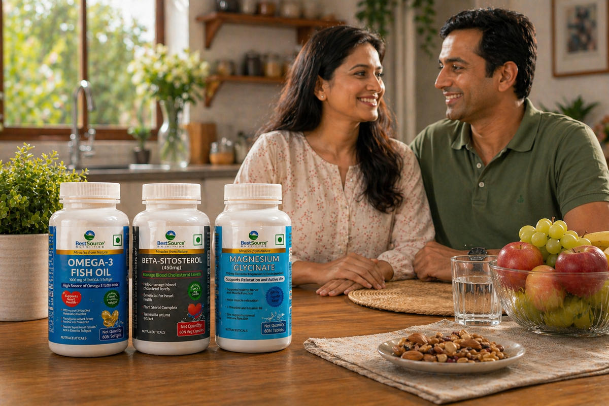Couple sitting at a table with bestsource heart wellnesst bottles and a healthy snack.