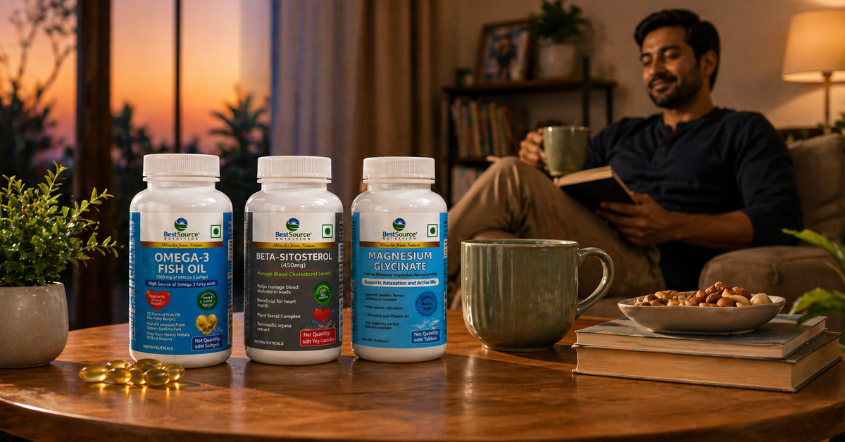 heart health supplement bottles on a table with a man reading a book in the background.